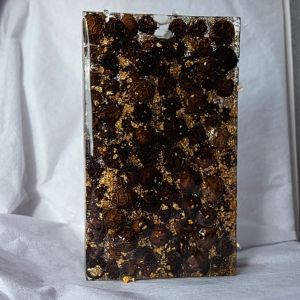 125 peppercorns and gold leaf in a resin block (Front view)